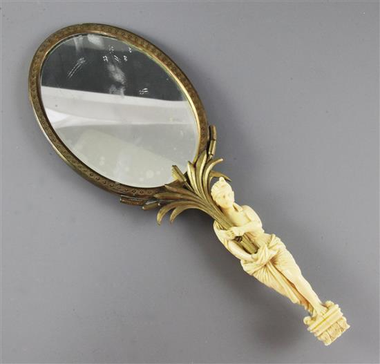 A 19th century French ormolu hand mirror, 12.25in.